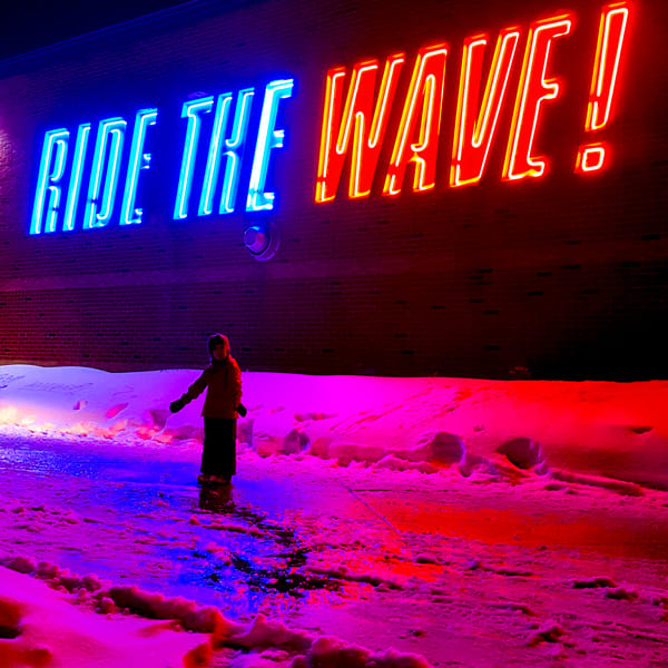 ride the wave, wave pool, outside, winter, kid, pink, blue sign, lights
